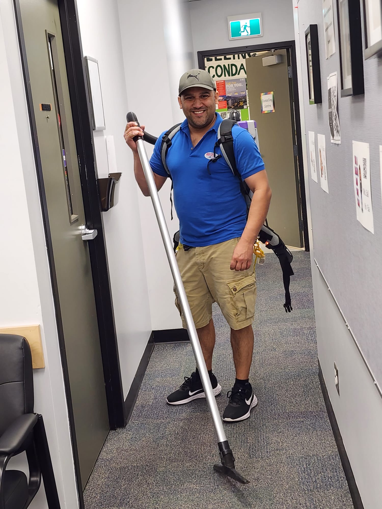 Male Worker Vacuuming